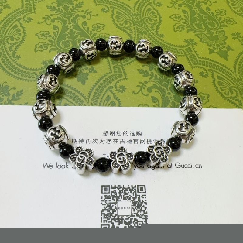 G*u*i bracelets